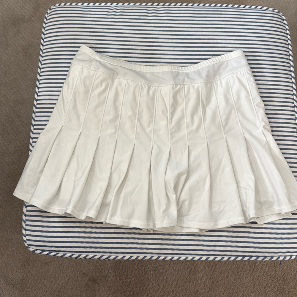 Women’s lucky in love white pleated tennis skirt. Size medium.